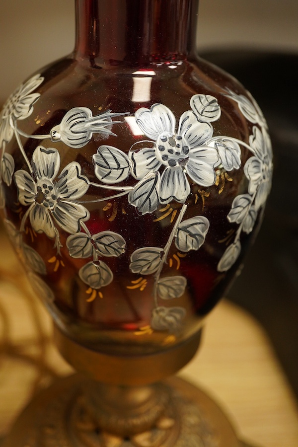 A pair of ruby glass, enamel and gilt metal table lamps, 57cm
